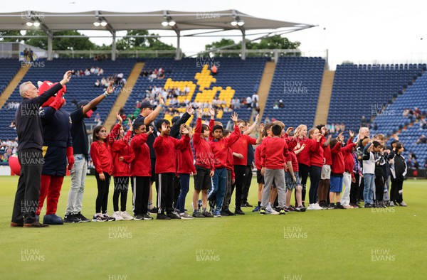 070622 -  Glamorgan v Gloucestershire, T20 Vitality Blast - Schoolchildren wave to the crowd during the interval