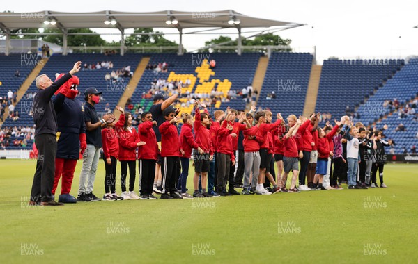 070622 -  Glamorgan v Gloucestershire, T20 Vitality Blast - Schoolchildren wave to the crowd during the interval