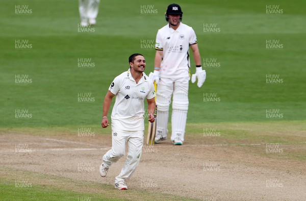 080423 - Glamorgan v Gloucestershire - LV= County Championship - Kiran Carlson of Glamorgan celebrates after bowling out Marcus Harris for LBW