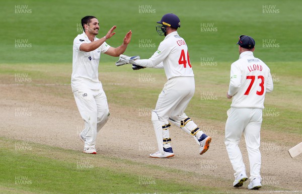 080423 - Glamorgan v Gloucestershire - LV= County Championship - Kiran Carlson of Glamorgan celebrates after bowling out Marcus Harris for LBW