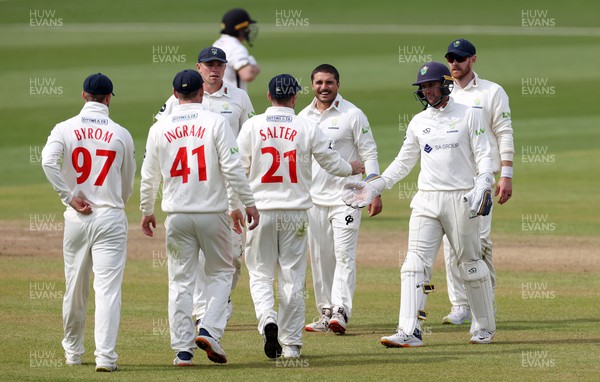 090423 - Glamorgan v Gloucestershire - LV= County Championship - Kiran Carlson of Glamorgan and team mates celebrate after Zafar Gohar is caught by Andrew Salter
