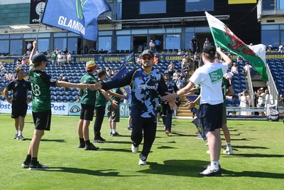 130725 - Glamorgan v Gloucestershire - T20, Vitality Blast - Kiran Carlson of Glamorgan runs out for the start of the match
