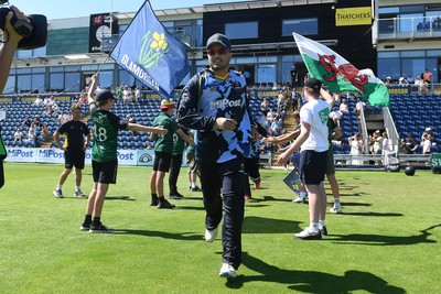 130725 - Glamorgan v Gloucestershire - T20, Vitality Blast - Kiran Carlson of Glamorgan runs out for the start of the match