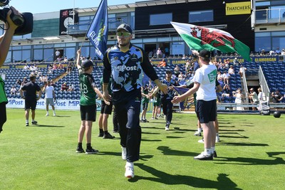 130725 - Glamorgan v Gloucestershire - T20, Vitality Blast - Mason Crane of Glamorgan runs out for the start of the match