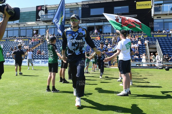 130725 - Glamorgan v Gloucestershire - T20, Vitality Blast - Mason Crane of Glamorgan runs out for the start of the match