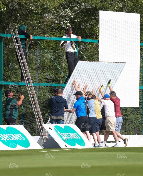 150519 - Glamorgan v Gloucestershire, Specsavers County Championship Division 2, Day 2 - The sight screen that collapsed towards David Payne of Gloucestershire is repaired during the interval