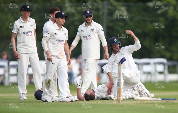 150519 - Glamorgan v Gloucestershire, Specsavers County Championship Division 2, Day 2 - Graham Wagg of Glamorgan calls for assistance after Chris Cooke of Glamorgan picks up an injury