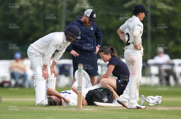 150519 - Glamorgan v Gloucestershire, Specsavers County Championship Division 2, Day 2 - Chris Cooke of Glamorgan receives treatment after picking up an injury