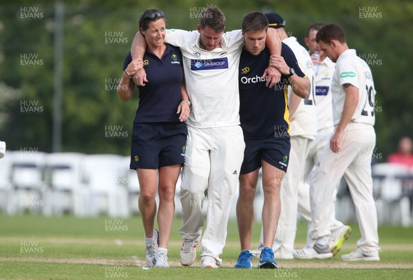 150519 - Glamorgan v Gloucestershire, Specsavers County Championship Division 2, Day 2 - Chris Cooke of Glamorgan is helped from the field of play after being forced to retire with an injury