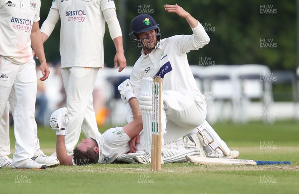 150519 - Glamorgan v Gloucestershire, Specsavers County Championship Division 2, Day 2 - Graham Wagg of Glamorgan calls for assistance after Chris Cooke of Glamorgan picks up an injury