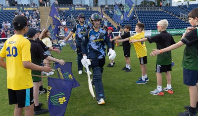 230526 - Glamorgan v Gloucestershire, Vitality Blast Men - Will Smale of Glamorgan and Alex Horton of Glamorgan make their way for the start of the match
