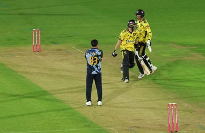 230526 - Glamorgan v Gloucestershire, Vitality Blast Men -  Kamran Dhariwal of Gloucestershire and Matt Taylor of Gloucestershire celebrate the winning runs on the final ball of the match