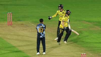 230526 - Glamorgan v Gloucestershire, Vitality Blast Men -  Kamran Dhariwal of Gloucestershire and Matt Taylor of Gloucestershire celebrate the winning runs on the final ball of the match