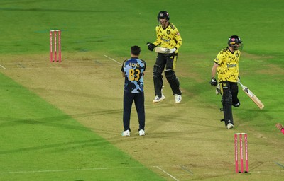 230526 - Glamorgan v Gloucestershire, Vitality Blast Men -  Kamran Dhariwal of Gloucestershire and Matt Taylor of Gloucestershire celebrate the winning runs on the final ball of the match