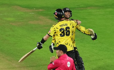 230526 - Glamorgan v Gloucestershire, Vitality Blast Men -  Kamran Dhariwal of Gloucestershire and Matt Taylor of Gloucestershire celebrate the winning runs on the final ball of the match