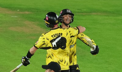 230526 - Glamorgan v Gloucestershire, Vitality Blast Men -  Kamran Dhariwal of Gloucestershire and Matt Taylor of Gloucestershire celebrate the winning runs on the final ball of the match