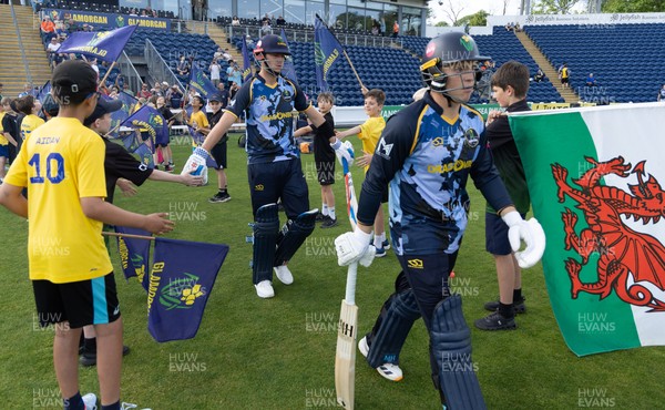 230526 - Glamorgan v Gloucestershire, Vitality Blast Men - Will Smale of Glamorgan and Alex Horton of Glamorgan make their way for the start of the match
