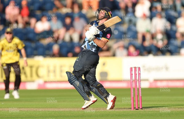 230526 - Glamorgan v Gloucestershire, Vitality Blast Men -  Chris Cooke of Glamorgan  sends the ball towards the boundary but is caught by Craig Miles of Gloucestershire