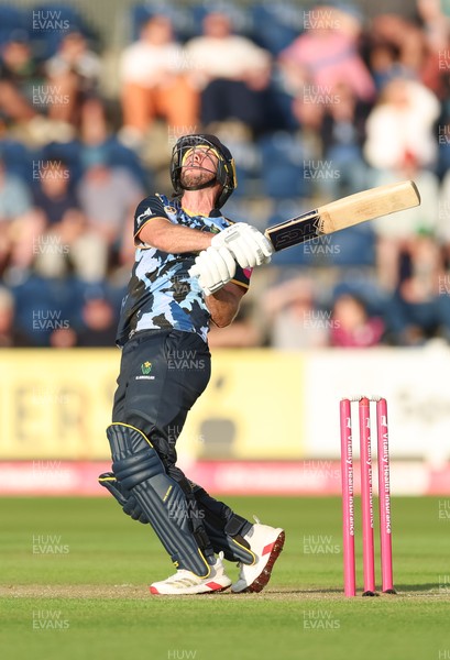 230526 - Glamorgan v Gloucestershire, Vitality Blast Men -  Chris Cooke of Glamorgan  sends the ball towards the boundary but is caught by Craig Miles of Gloucestershire