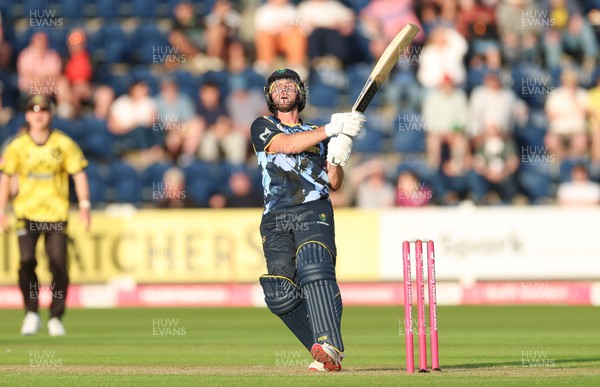 230526 - Glamorgan v Gloucestershire, Vitality Blast Men -  Chris Cooke of Glamorgan  sends the ball towards the boundary but is caught by Craig Miles of Gloucestershire