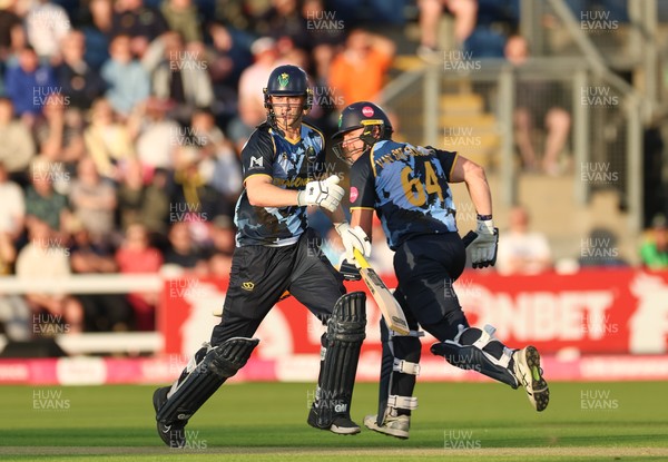 230526 - Glamorgan v Gloucestershire, Vitality Blast Men -  Henry Hurle of Glamorgan adds the runs alongside Timm van der Gugten of Glamorgan