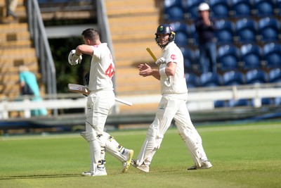 280924 - Glamorgan v Gloucestershire - County Championship - Chris Cooke and Sam Northeast of Glamorgan leave field after hitting a century on the last ball