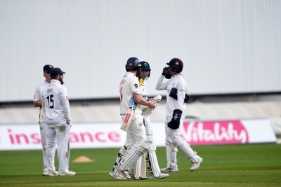 280924 - Glamorgan v Gloucestershire - County Championship - Chris Cooke of Glamorgan celebrates with Sam Northeast of Glamorgan after hitting a century