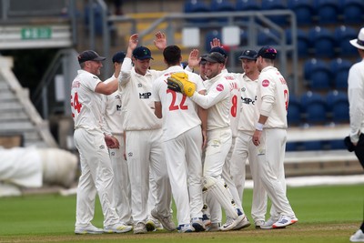 280924 - Glamorgan v Gloucestershire - County Championship - Ned Leonard of Glamorgan celebrates with team mates after bowling out Chris Dent of Gloucestershire