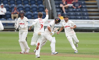 290625  Glamorgan v Gloucestershire, Rothesay County Championship Division 2 - Celebrations as Kiran Carlson of Glamorgan catches Miles Hammond of Gloucestershire off the bowling of Mason Crane of Glamorgan