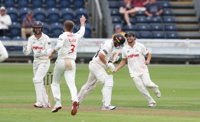 290625  Glamorgan v Gloucestershire, Rothesay County Championship Division 2 - Celebrations as Kiran Carlson of Glamorgan catches Miles Hammond of Gloucestershire off the bowling of Mason Crane of Glamorgan
