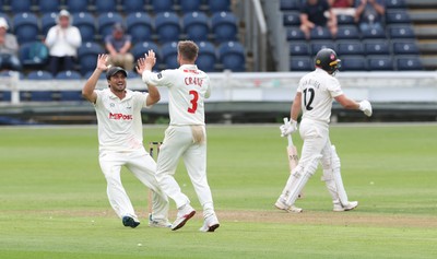 290625  Glamorgan v Gloucestershire, Rothesay County Championship Division 2 - Kiran Carlson of Glamorgan celebrates with Mason Crane of Glamorgan after taking the wicket of Graeme Van Buuren of Gloucestershire