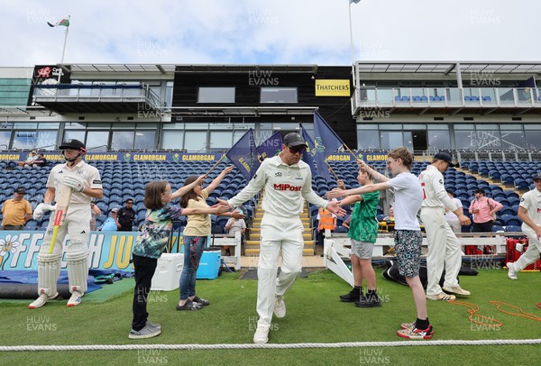 290625  Glamorgan v Gloucestershire, Rothesay County Championship Division 2 - Colin Ingram of Glamorgan makes his way through the guard of honour