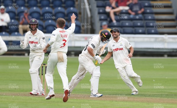 290625  Glamorgan v Gloucestershire, Rothesay County Championship Division 2 - Celebrations as Kiran Carlson of Glamorgan catches Miles Hammond of Gloucestershire off the bowling of Mason Crane of Glamorgan