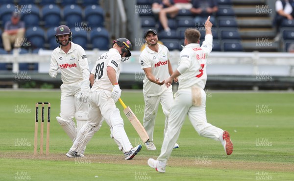290625  Glamorgan v Gloucestershire, Rothesay County Championship Division 2 - Celebrations as Kiran Carlson of Glamorgan catches Miles Hammond of Gloucestershire off the bowling of Mason Crane of Glamorgan