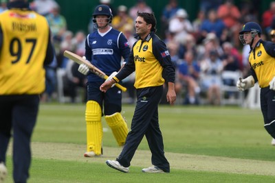050825 - Glamorgan v Hampshire - Metro Bank One Day Cup - Kiran Carlson of Glamorgan celebrates with team mates after he bowls the ball to dismiss Tom Prest of Hampshire