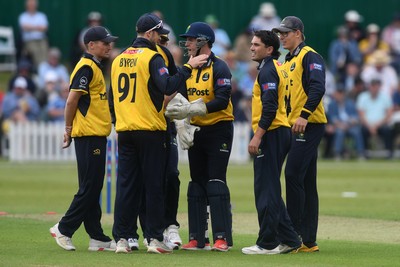 050825 - Glamorgan v Hampshire - Metro Bank One Day Cup - Kiran Carlson of Glamorgan celebrates with team mates after he bowls the ball to dismiss Tom Prest of Hampshire