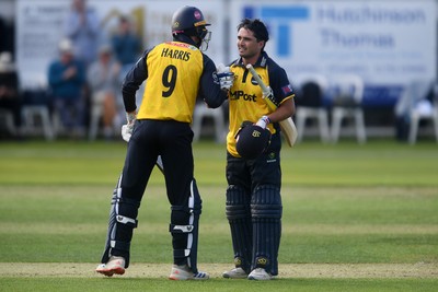 050825 - Glamorgan v Hampshire - Metro Bank One Day Cup - James Harris congratulates Kiran Carlson of Glamorgan as he hits a century