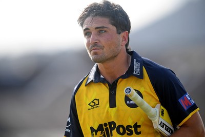 050825 - Glamorgan v Hampshire - Metro Bank One Day Cup - Kiran Carlson of Glamorgan is caught out by Tom Prest of Hampshire but congratulated for hitting a career best of 135