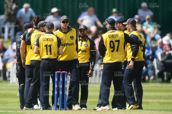 050825 - Glamorgan v Hampshire - Metro Bank One Day Cup - Asa Tribe of Glamorgan celebrates with team mates after he catches the ball to dismiss Tilak Varma of Hampshire