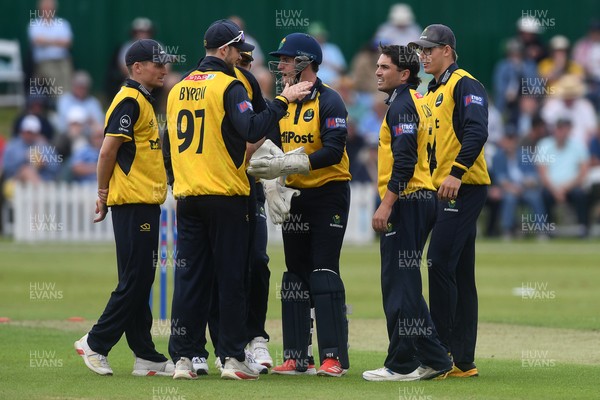 050825 - Glamorgan v Hampshire - Metro Bank One Day Cup - Kiran Carlson of Glamorgan celebrates with team mates after he bowls the ball to dismiss Tom Prest of Hampshire