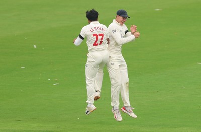 270826 - Glamorgan v Hampshire, Rothesay County Championship Division 1 - Zain ul Hassan of Glamorgan celebrates with Asa Tribe of Glamorgan after he bowls Toby Albert of Hampshire