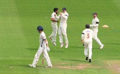 270826 - Glamorgan v Hampshire, Rothesay County Championship Division 1 - Zain ul Hassan of Glamorgan celebrates with Asa Tribe of Glamorgan after he takes the wicket of Ali Orr of Hampshire