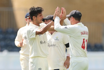270826 - Glamorgan v Hampshire, Rothesay County Championship Division 1 - Mir Hamza of Glamorgan celebrates with Colin Ingram of Glamorgan after taking the wicket of Andrew Neal of Hampshire
