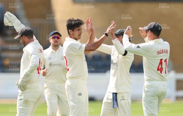 270826 - Glamorgan v Hampshire, Rothesay County Championship Division 1 - Mir Hamza of Glamorgan celebrates with Colin Ingram of Glamorgan after taking the wicket of Andrew Neal of Hampshire