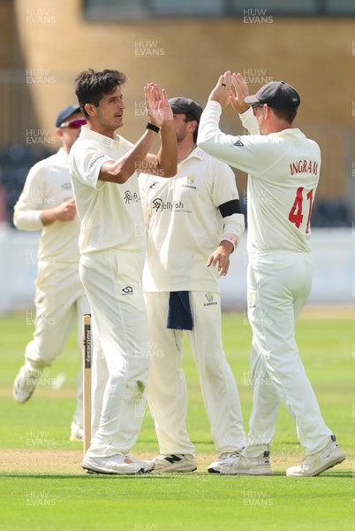 270826 - Glamorgan v Hampshire, Rothesay County Championship Division 1 - Mir Hamza of Glamorgan celebrates with Colin Ingram of Glamorgan after taking the wicket of Andrew Neal of Hampshire