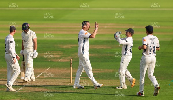 270826 - Glamorgan v Hampshire, Rothesay County Championship Division 1 - Kyle Abbott of Hampshire celebrates as he dismisses Colin Ingram of Glamorgan