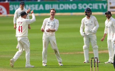 300826 Glamorgan v Hampshire, Rothesay County Championship Division 1 - Ben Kellaway of Glamorgan  celebrates with Colin Ingram of Glamorgan after taking the wicket of James Fuller of Hampshire