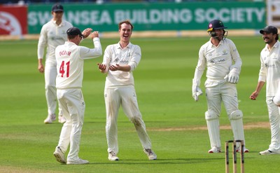 300826 Glamorgan v Hampshire, Rothesay County Championship Division 1 - Ben Kellaway of Glamorgan  celebrates with Colin Ingram of Glamorgan after taking the wicket of James Fuller of Hampshire