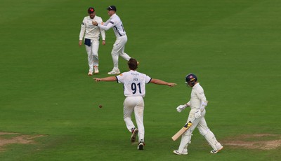 300826 Glamorgan v Hampshire, Rothesay County Championship Division 1 - Eddie Jack of Hampshire celebrates as he dismisses Mason Crane of Glamorgan
