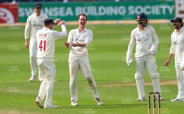 300826 Glamorgan v Hampshire, Rothesay County Championship Division 1 - Ben Kellaway of Glamorgan  celebrates with Colin Ingram of Glamorgan after taking the wicket of James Fuller of Hampshire
